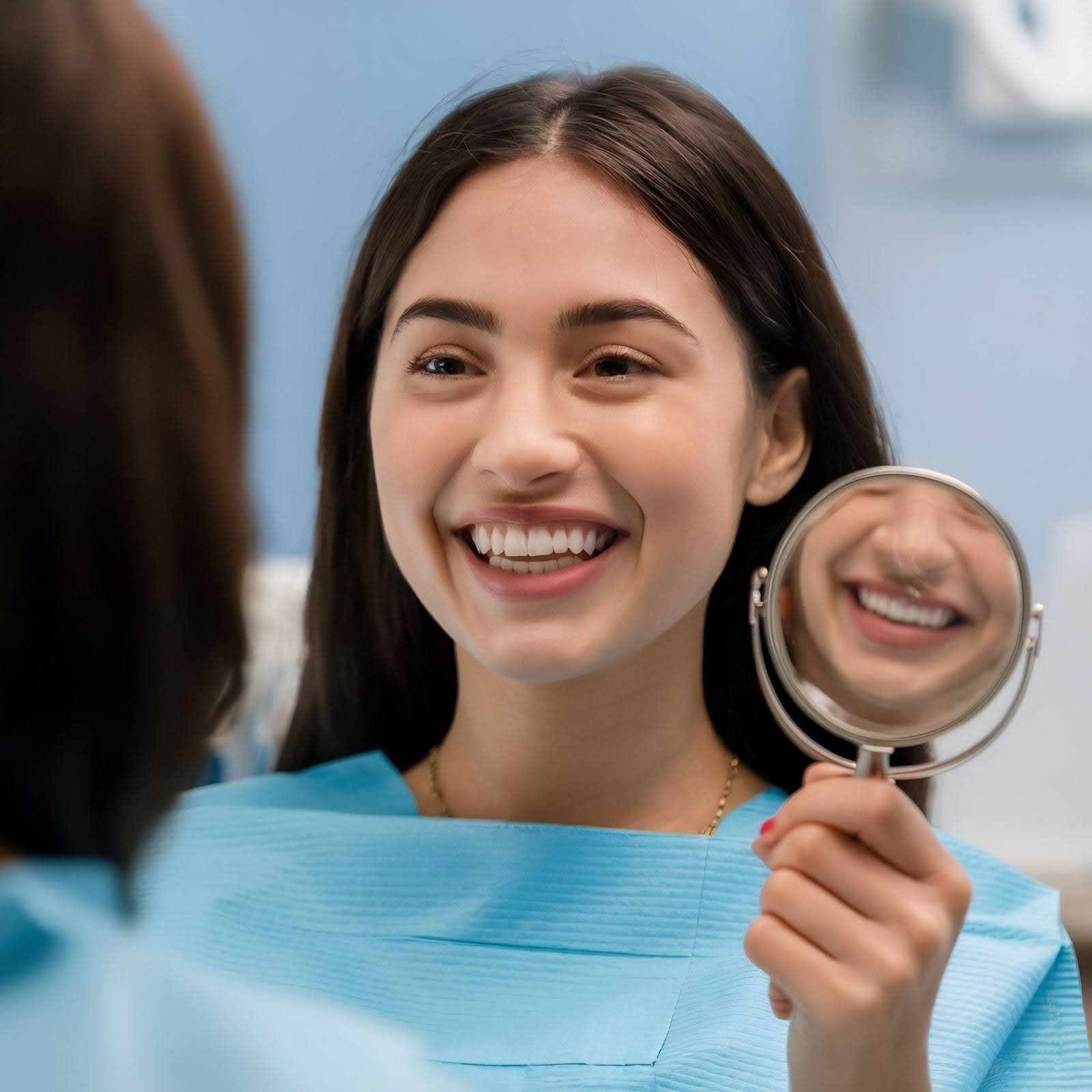 A patient seeing her new smile at Dante Gonzales Orthodontics in Dublin, CA