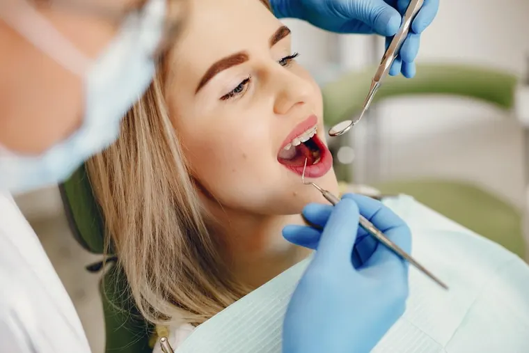 Orthodontic patient having her braces adjusted